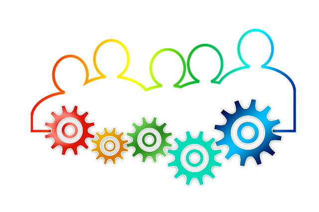 Outline of 5 people in red, orange, yellow, green and blue, each with a cog wheel.